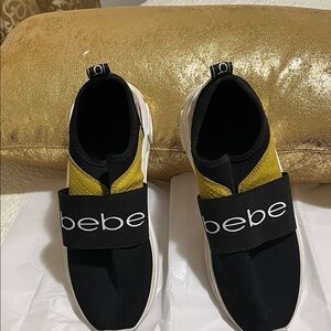 Bebe Black and Gold Slip-On Shoes